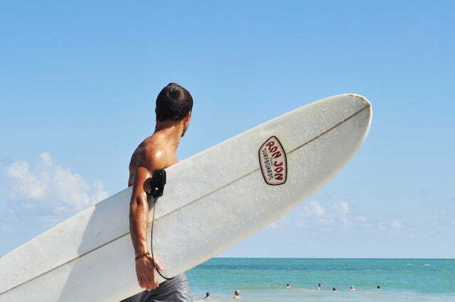man met surfboard